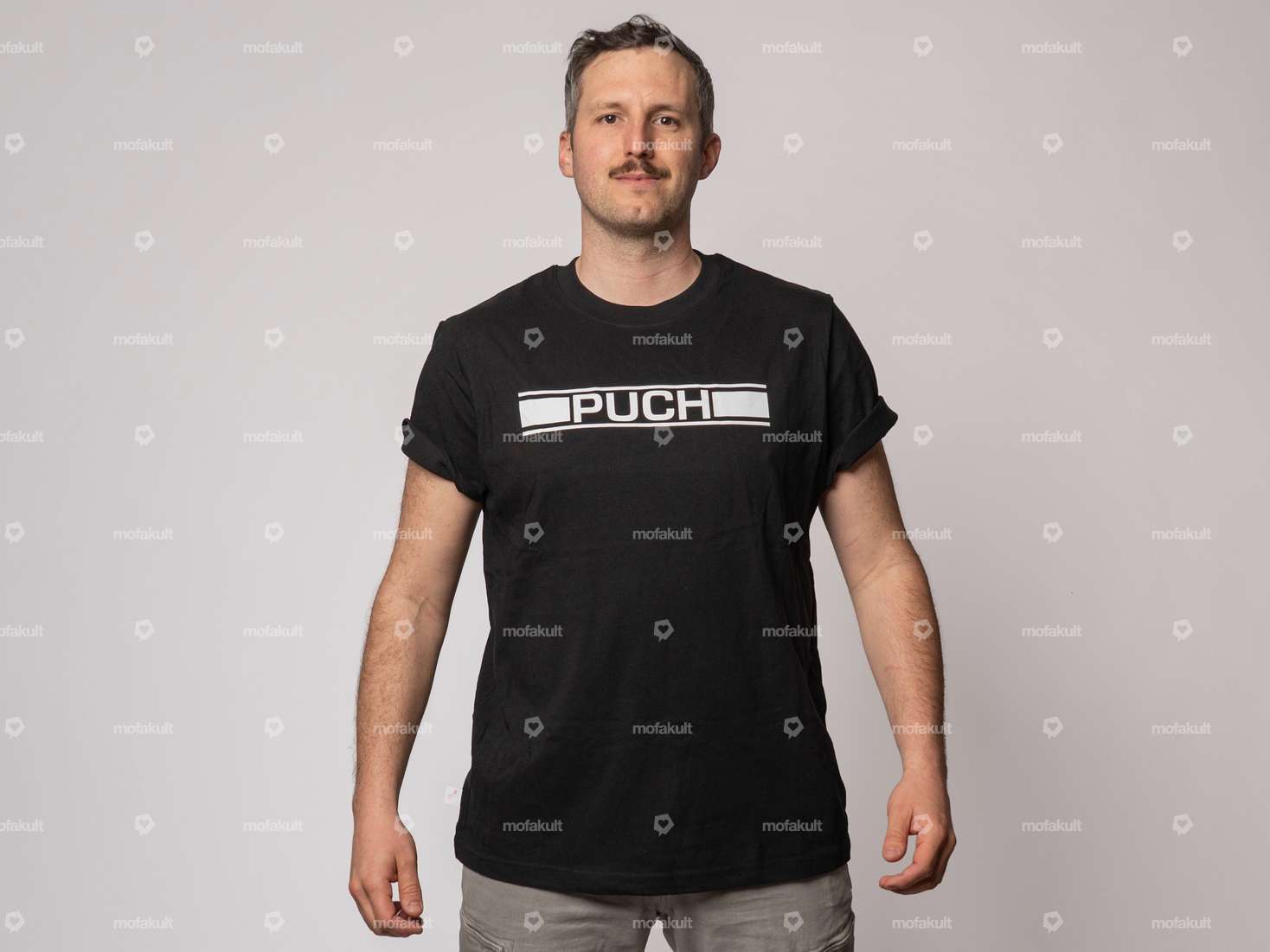 mk-Merch T-Shirt «PUCH» schwarz Carousel Image 1